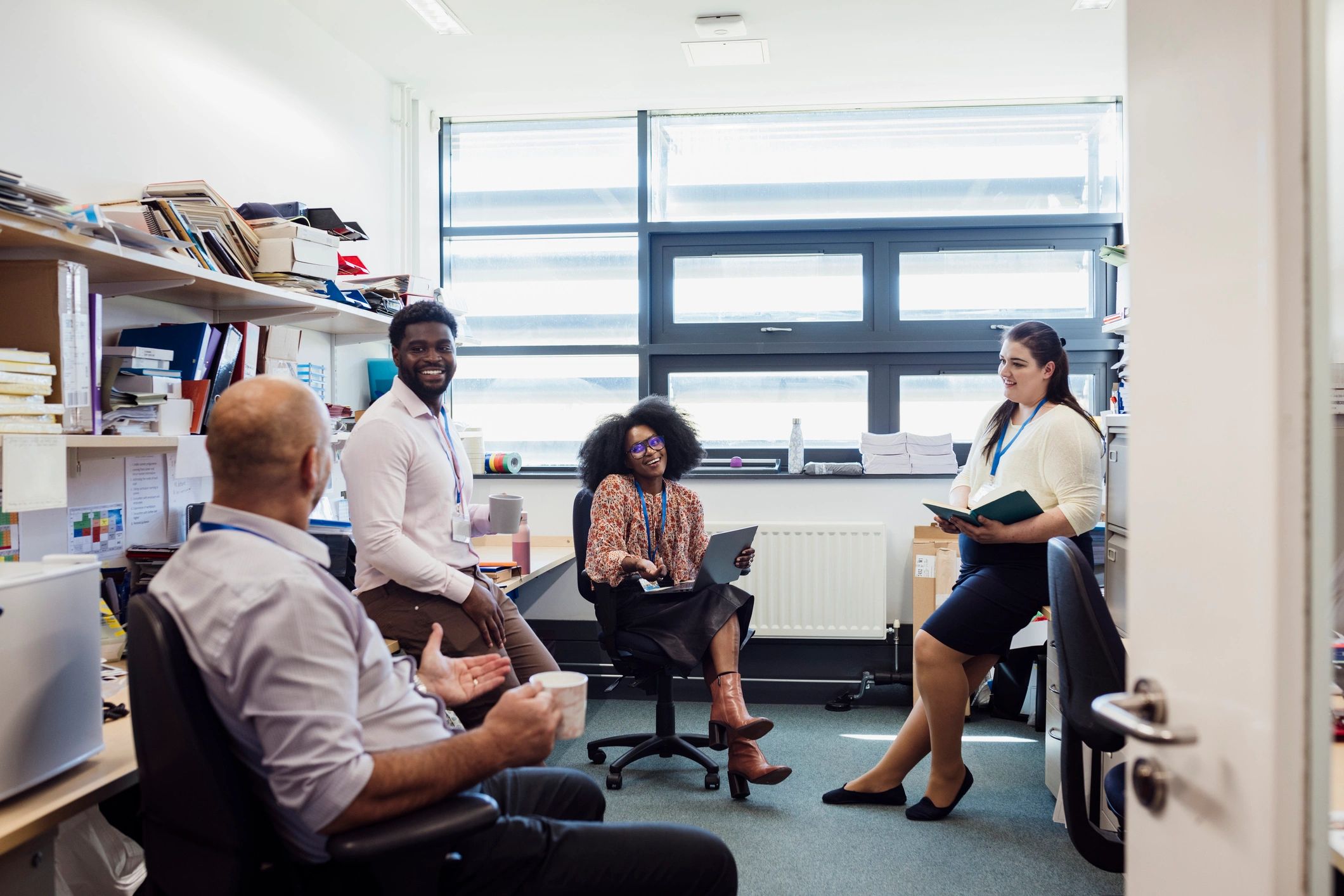 Academic colleagues in discussion during a meeting